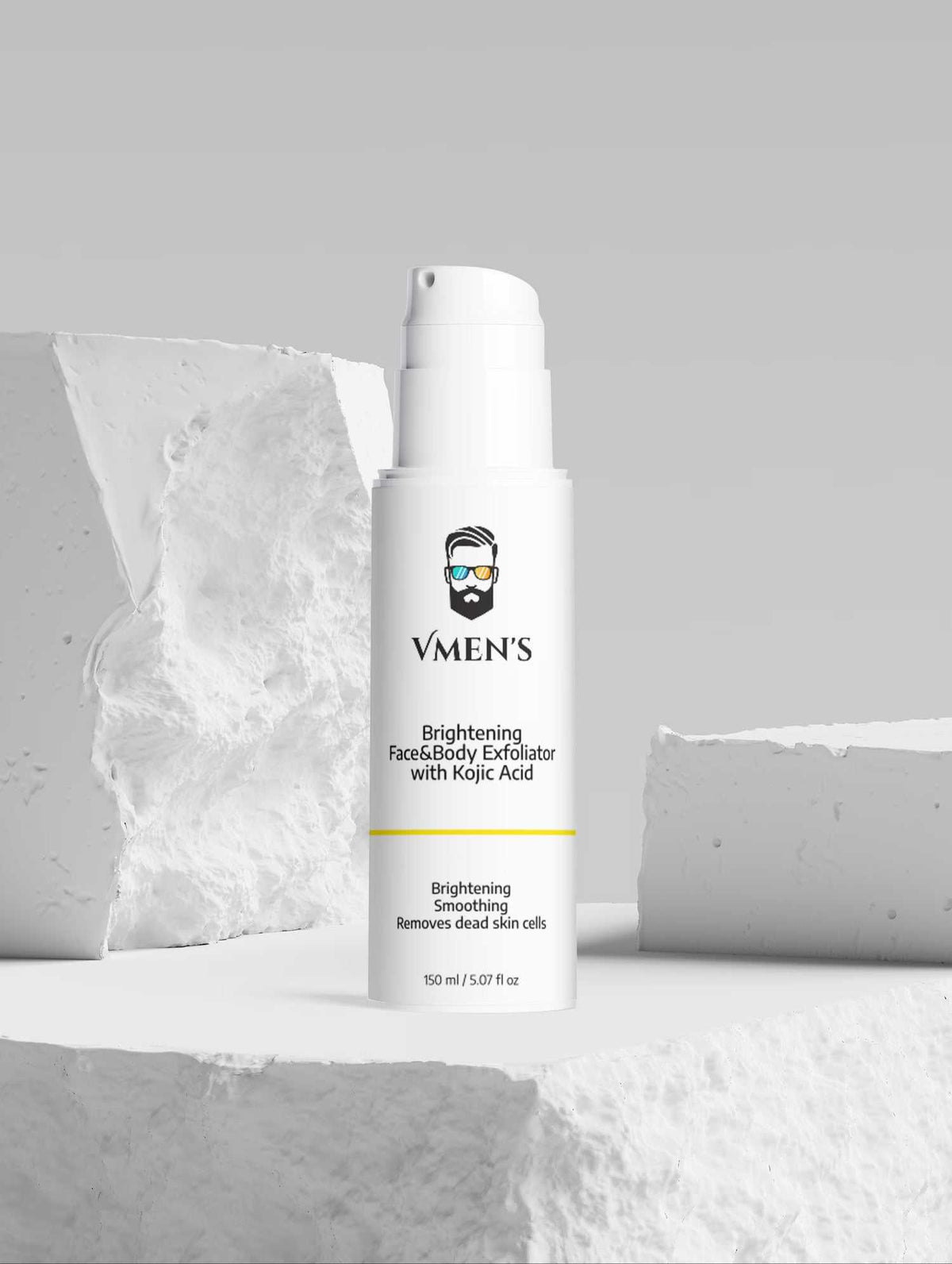 VMEN’S Kojic Acid Face & Body Exfoliator displayed among white stone blocks.