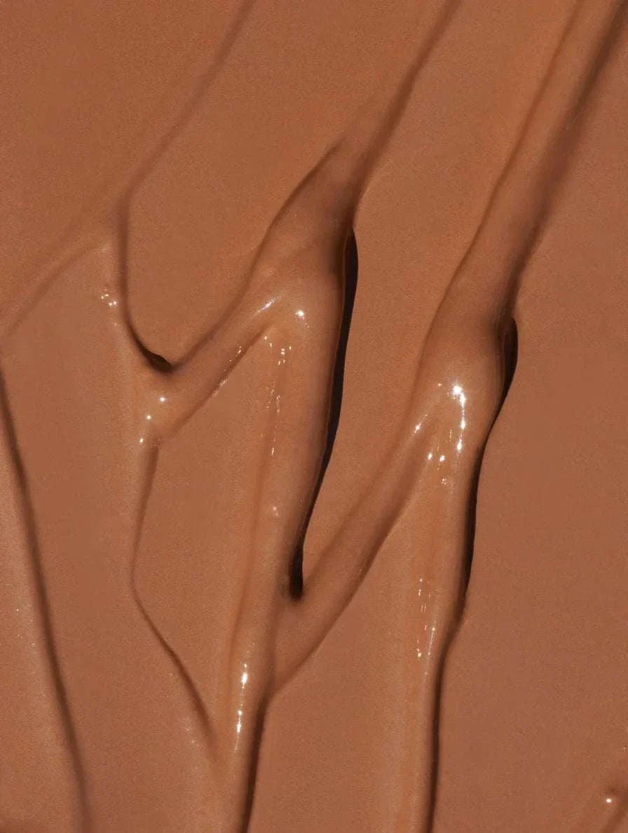 30 Tan Neutral Correcting Concealer in a creamy, smooth texture, featuring a warm, medium brown shade.