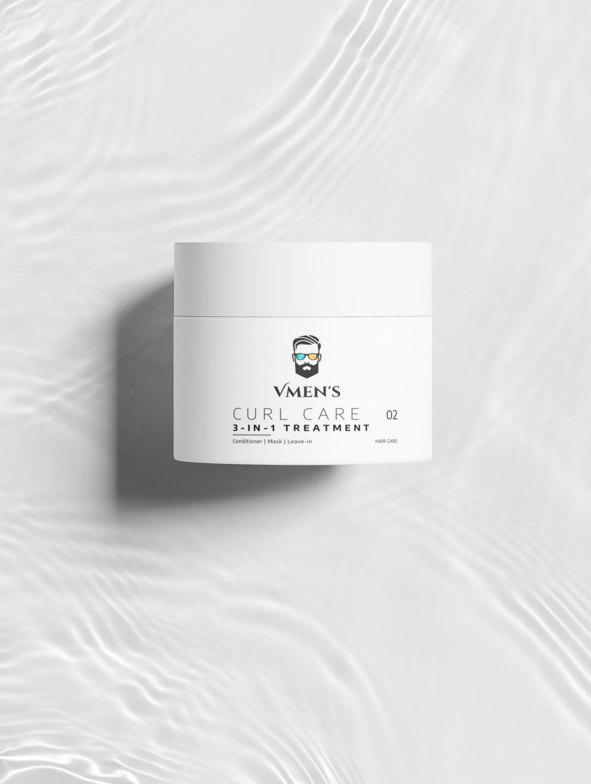 VMEN’S CURL CARE 02 Treatment jar viewed from above on a white surface with rippling light.