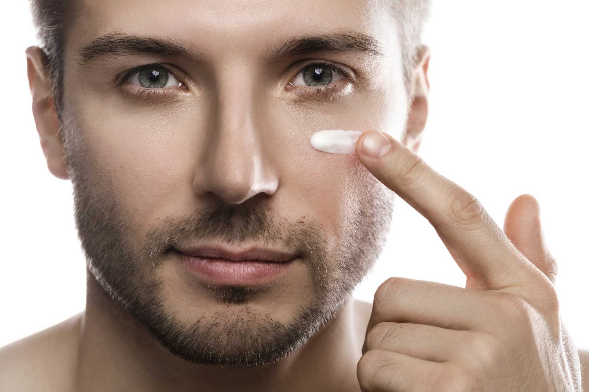 Man applying  Smoothing Eye Cream