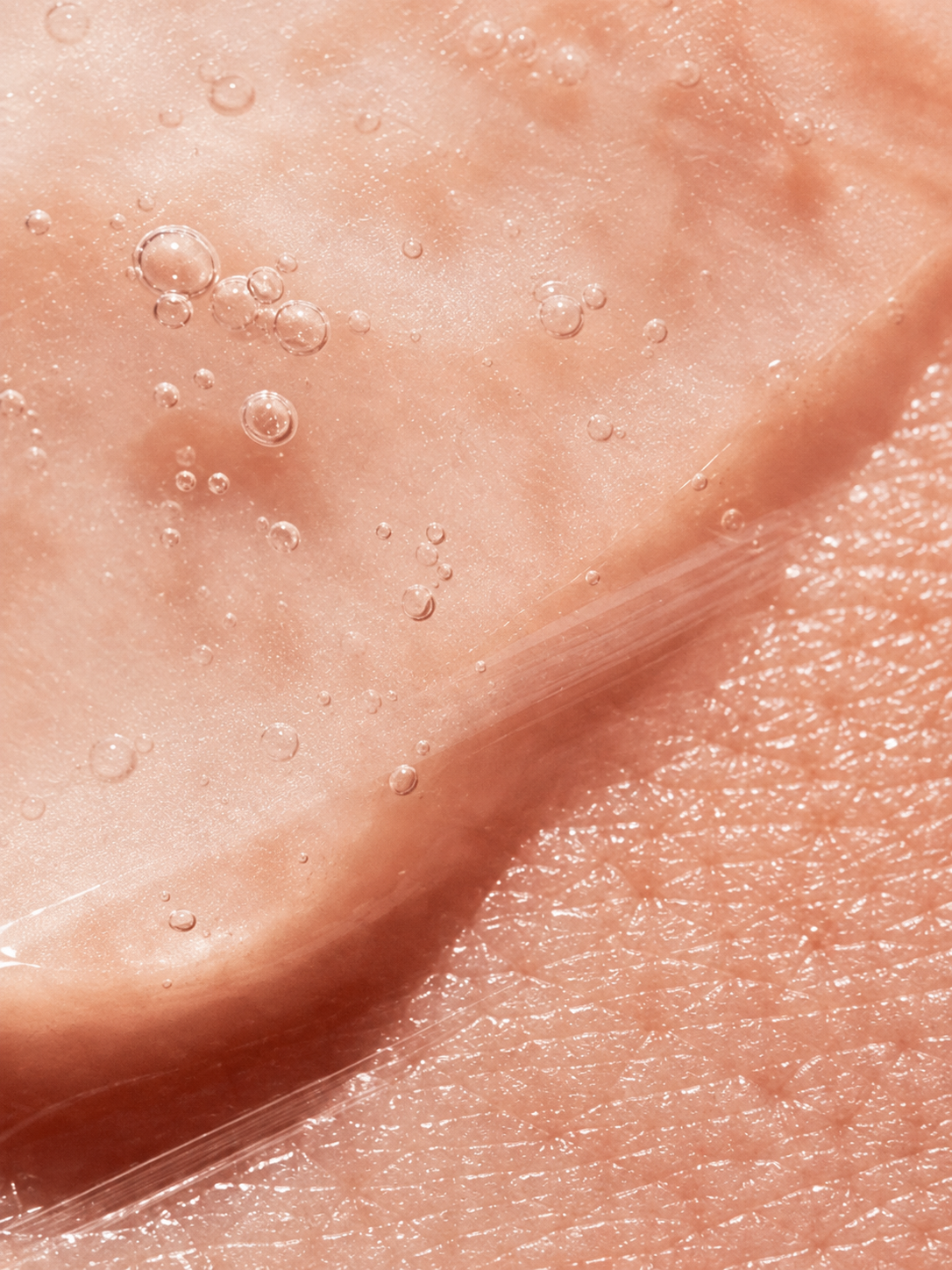 Extreme close-up of smooth, glossy skin with visible 10% Lactic Acid Peel for Men VMEN&