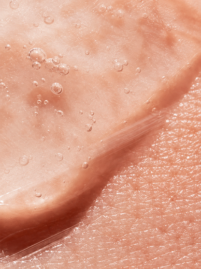 Extreme close-up of smooth, glossy skin with visible 10% Lactic Acid Peel for Men VMEN&