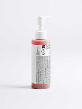 Radiant Glow Facial Wash for Men in a transparent bottle with a white pump, pinkish liquid visible inside.
