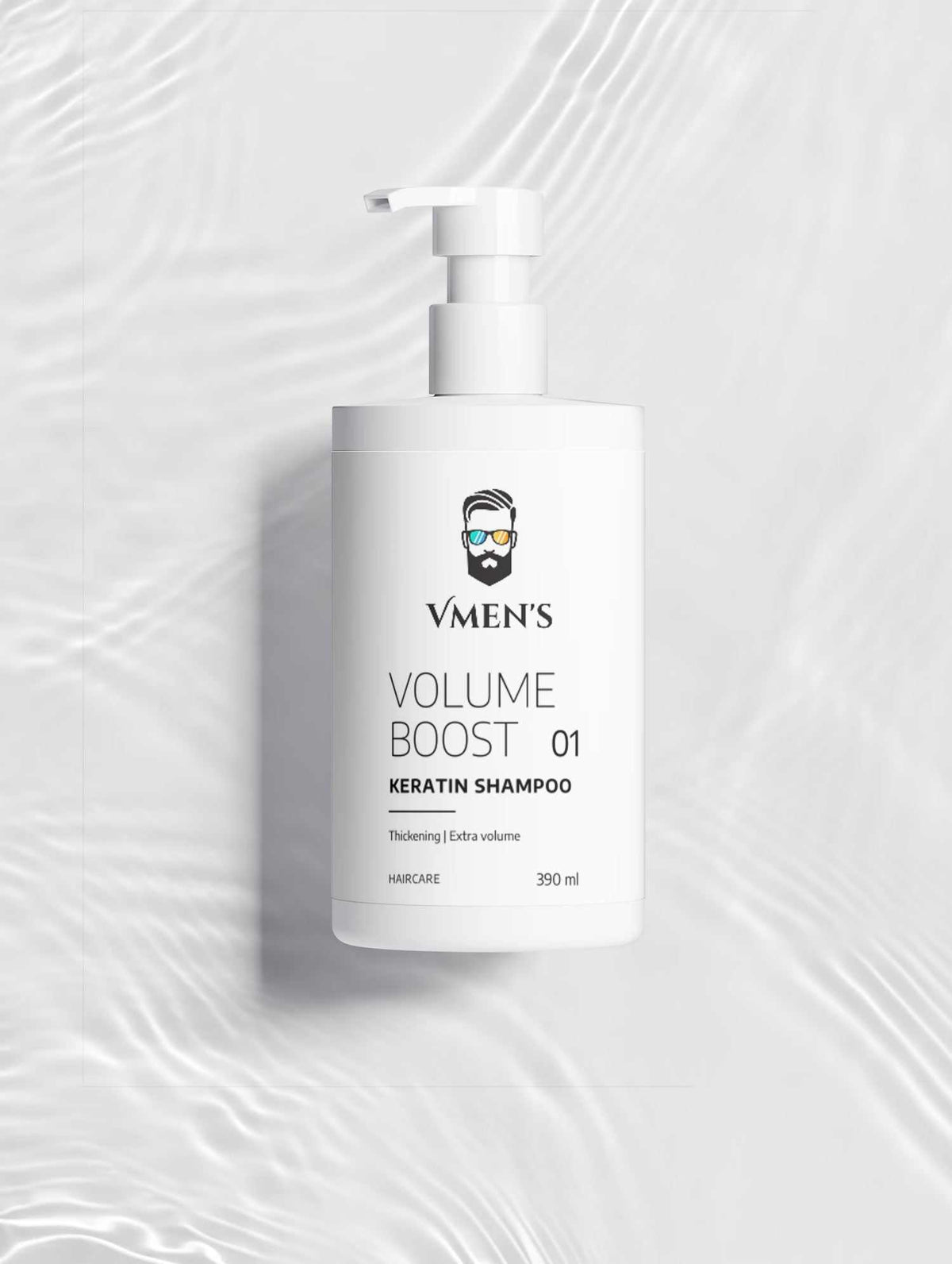 VMEN’S Keratin Volume Boost Shampoo on a white surface with rippling water reflections.