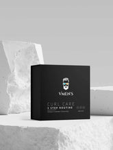 Black box with white text and a logo, labeled "VMEN&