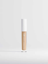 Correcting Concealer for Men in shade 15 Medium Cool, with a creamy texture in a clear tube and a white cap.