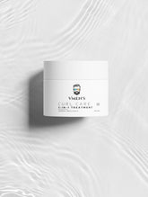 VMEN’S CURL CARE 02 Treatment jar viewed from above on a white surface with rippling light.