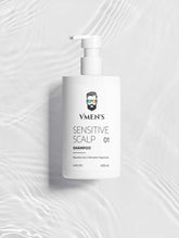VMEN’S Sensitive Scalp Shampoo for Men on a white surface with rippling water reflections.
