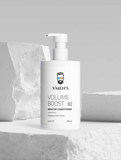 VMEN’S Keratin Volume Boost Conditioner white pump bottle displayed among white stone blocks.