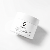 VMEN’S 3-in-1 Curly Hair Treatment for Men jar tilted on a white surface with a soft shadow.