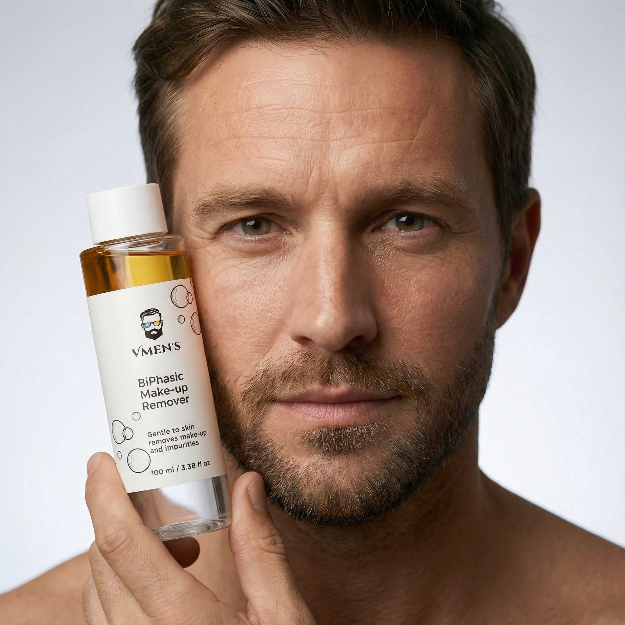 Close-up of men’s biphasic makeup remover showing dual-phase oil and water texture