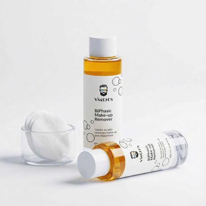 Men’s biphasic makeup remover with cotton pads on clean minimalist background