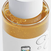 Close-up of men’s biphasic makeup remover showing dual-phase oil and water texture
