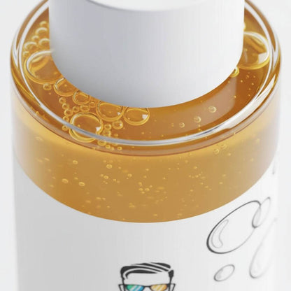 Close-up of men’s biphasic makeup remover showing dual-phase oil and water texture