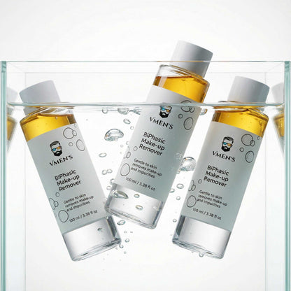 Men’s biphasic makeup remover bottles submerged in water highlighting dual-phase formula